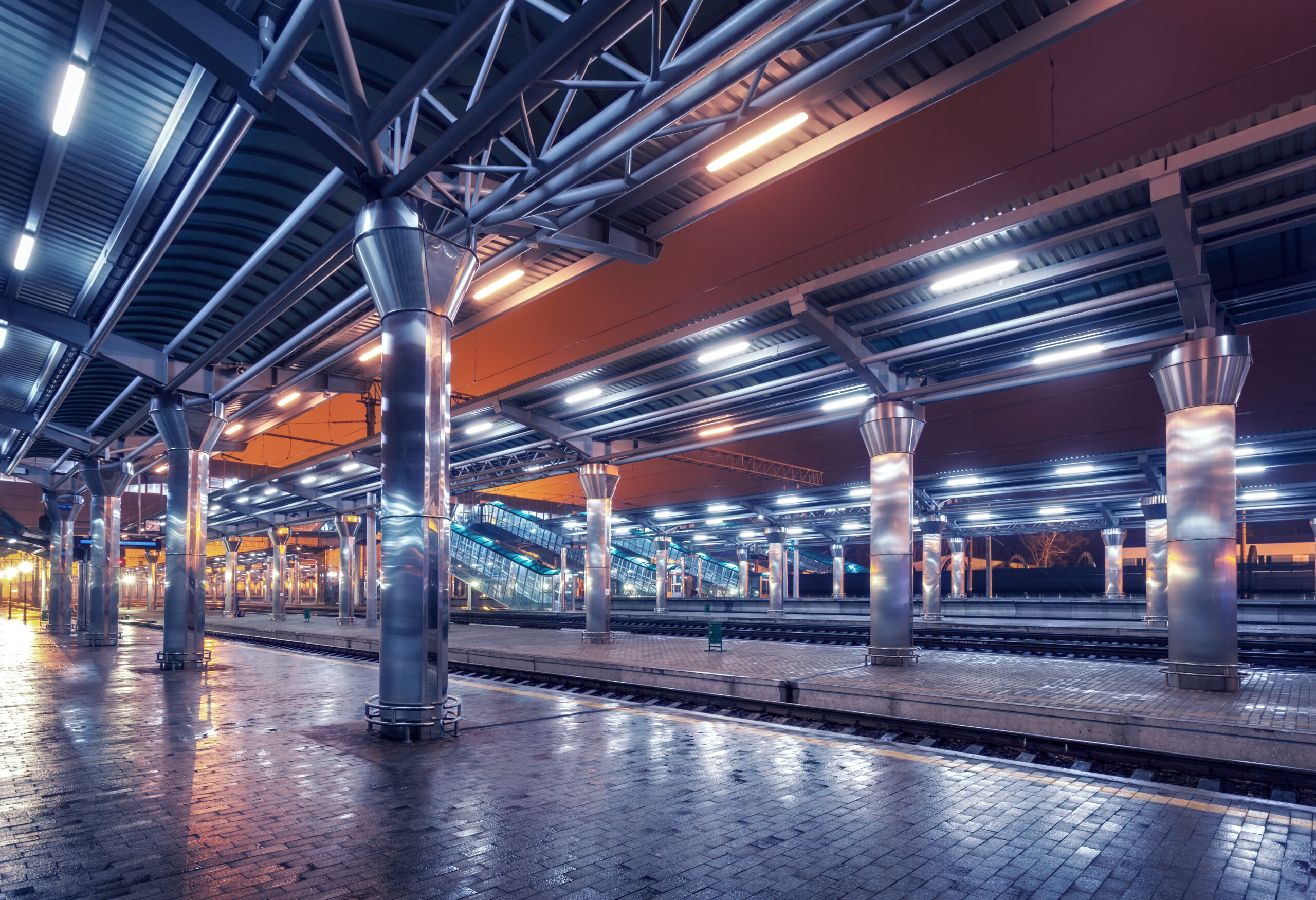 Railway station at night. train platform in fog. railroad